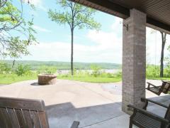 Lower level walks out onto patio with outdoor kitchen, fire pit and hot tub.