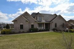 Situated on .6 Acres in Triple Crown Country Club, this home is resplendent in its classic design, ease of living and well appointed amenities. Filled with detailed moldings, stunning vaulted ceilings, 2 Fireplaces and 3 Finished Levels!