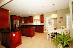 Open to the Great Room, the Chef's Kitchen gleams with Granite & Stainless.