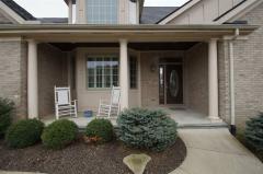 Beautiful Landscaping enhances the charm of the Front Porch.