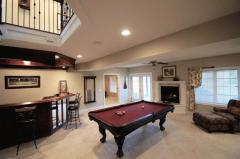 Perfect for informal gatherings with wet bar, fireplace and walk-out to the Patio.