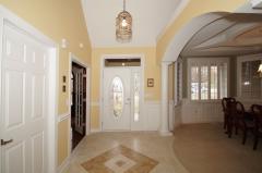 Tiled floor with ceramic inlay plus arched openings and vaulted ceilings impress you upon entering.