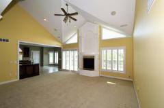 Soaring Great Room with beautiful architectural details and skylights.