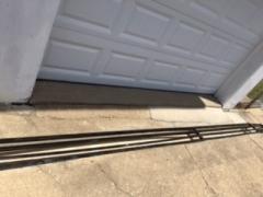 Owner added drain and grating in front of garage because water came under door one time. Hasn't leaked since this was installed.