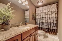 1st floor hall bath. Granite countertop, ceramic tile, tub/shower combo