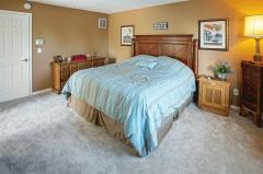 Master suite w/ adjoining master bath & walk-in closet.