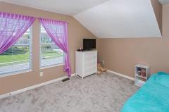 2nd bedroom w/ new carpet, large walk-in closet & large window.