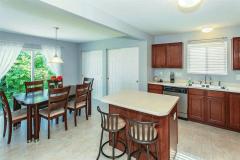 Gorgeous kitchen featuring stainless steel appliances, island, 2 large pantries & lots of natural lighting.