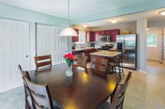 Gorgeous kitchen featuring stainless steel appliances, island, 2 large pantries & lots of natural lighting.