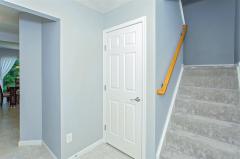 Entry area with stairs to the 2nd floor and door to the basement. New carpet & freshly painted interior!
