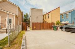 2 dedicated parking spaces behind the home with entry through the privacy fenec