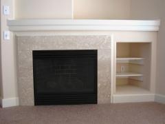 Gas fireplace with blower & beautiful Bottichino marble surround plus media center with shelves & cable outlet!