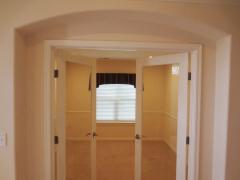 Privately located, the study boasts glass French doors, chair rail, cable/phone/UBS charger outlet & an abundance of energy-efficient LED can lights!