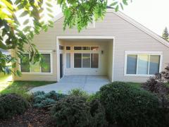 Back patio boasts an expanded patio & shows the abundance of windows this patio home offers!