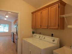 Conveniently located laundry room with a high-end Speed Queen washer & dryer provided!