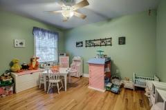 Fourth bedroom features hardwood floors
