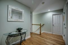 Upper level hall features hardwood floors