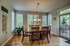 Sun-bathed breakfast room features walk-out