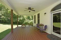 Covered Back Deck with Ceiling fan adjacent to breakfast room & Family Room.