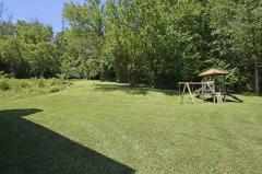 Back yard play sets, fire pits & trails.