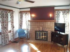 Wood burning fireplace with Rookwood Tile and Hardwood Floors