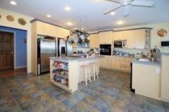 Built-in oven, smooth top range in the island. Refrigerator, Freezer, dishwasher and trash compactor. She didn't forget anything you'll need.