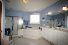 The Master Bath includes a whirlpool tub, large tiled shower and vanity with make-up station. You'll love it.