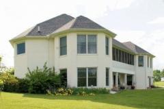 If you could design a perfect home for a large family or for entertaining, wouldn't it have beautiful landscaping, walls of windows, vaulted ceilings, screened porch and privacy? If that's what you like, then come see this French Country home!