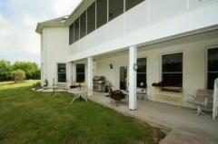 The lower level patio has access from two areas of the finished lower level. A walkway leads to it from the driveway so you can get inside the lower level without going through the upstairs.