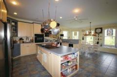 French country Kitchen! Italian porcelain tile flooring, center island plus counter/bar. Built-in shelving, several large pantries, & spectacular Breakfast Room with window seat and a wall of windows. Glass accents plus room for the Freezer & Refrigerator