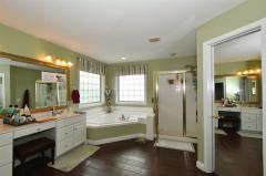 Luxurious! New Tiled Floor, Corner Tub, Separate Shower, Double Vanity, Two walk-in closets, Private water closet.