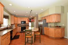 Beautifully remodeled with Granite counters, new built-in appliances that includes two ovens, gas range & dishwasher, tiled backsplash plus convenient planning desk, Butler's pantry and walk-out to the Screened Porch!