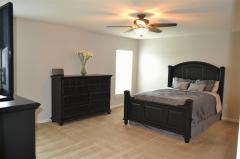 Large master bedroom with separate linen closet, ceiling fan, fresh paint and lots of square footage to accommodate a variety of different furniture arrangements.