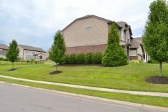 Corner lot has mature landscaping to enhance curb appeal. Brick wrap elevates curb appeal!