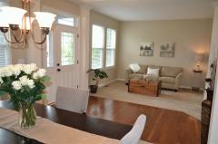 The gorgeous front door is flanked with a peaceful living room and a spacious dining room. NINE foot ceilings greet guests upon arrival!