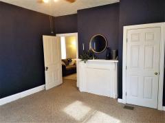 Really nice size Master Bedroom with 2 windows for natural light and this adorable dummy fireplace for decorating!
