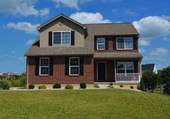 Deep Toned Cabinets with Soft Close Drawers * Granite Tops * Nice Island w. Additional Drawers & Cabinets * Stainless Appliances & Designer Tiled Floor!