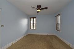 Wall to wall carpet, ceiling fan, pocket doors and window treatments can be found in this good sized room. Hardwood under carpet.