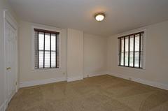 Nice size. Wall to wall carpet. Window treatments included.