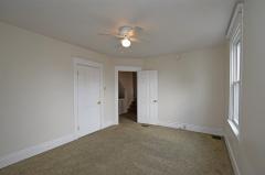 Wall to wall carpet and a decent closet for a spare bedroom.