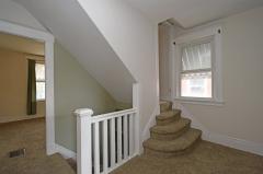 This shows the landing on the second floor and the stairs to the expansive third floor.