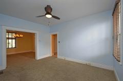 Tall ceilings make this room feel even larger than it is. A great view of the Butler's Pantry that leads into the breakfast room and half bathroom.
