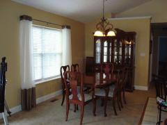 OPEN AREA IS CURRENTLY USED AS DINING ROOM*CHANDELIER*DOUBLE WINDOW*