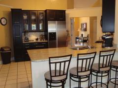 COUNTER TOP INFORMAL DINING AND FULL ON VIEW OF KITCHEN'S OPEN CONCEPT