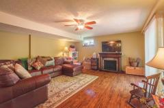 Beautiful lower level family room features a wet bar and walk out! While there is plenty of finished space, there is a large portion unfinished that is perfect for storage.
