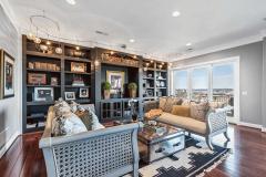 Flanking both ends of the Great Room are fabulous custom built-ins and dramatic lighting adds a fun accent!