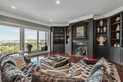 Flanking this cozy fireplace, a second set of custom built-ins provides the perfect place for an artful display!