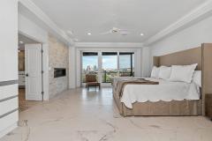 White on white design with heated marble floors and an amazing view! Features a modern gas fireplace and built-ins.