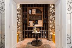 Designed to hold 280 bottles, the wine room is located just outside the home theatre.