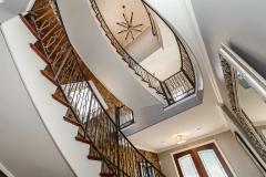 The floating staircase spans 3 levels and offers visual drama that is highlighted by a Gary Lord designed copper treated living wall - in this space the architecture is the art!